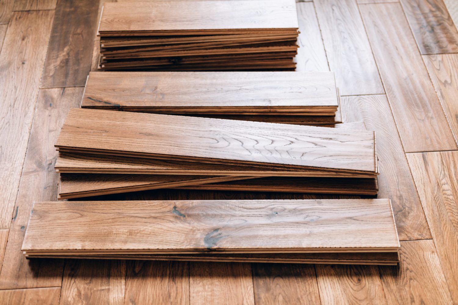 Solid oak hardwood flooring planks being installed